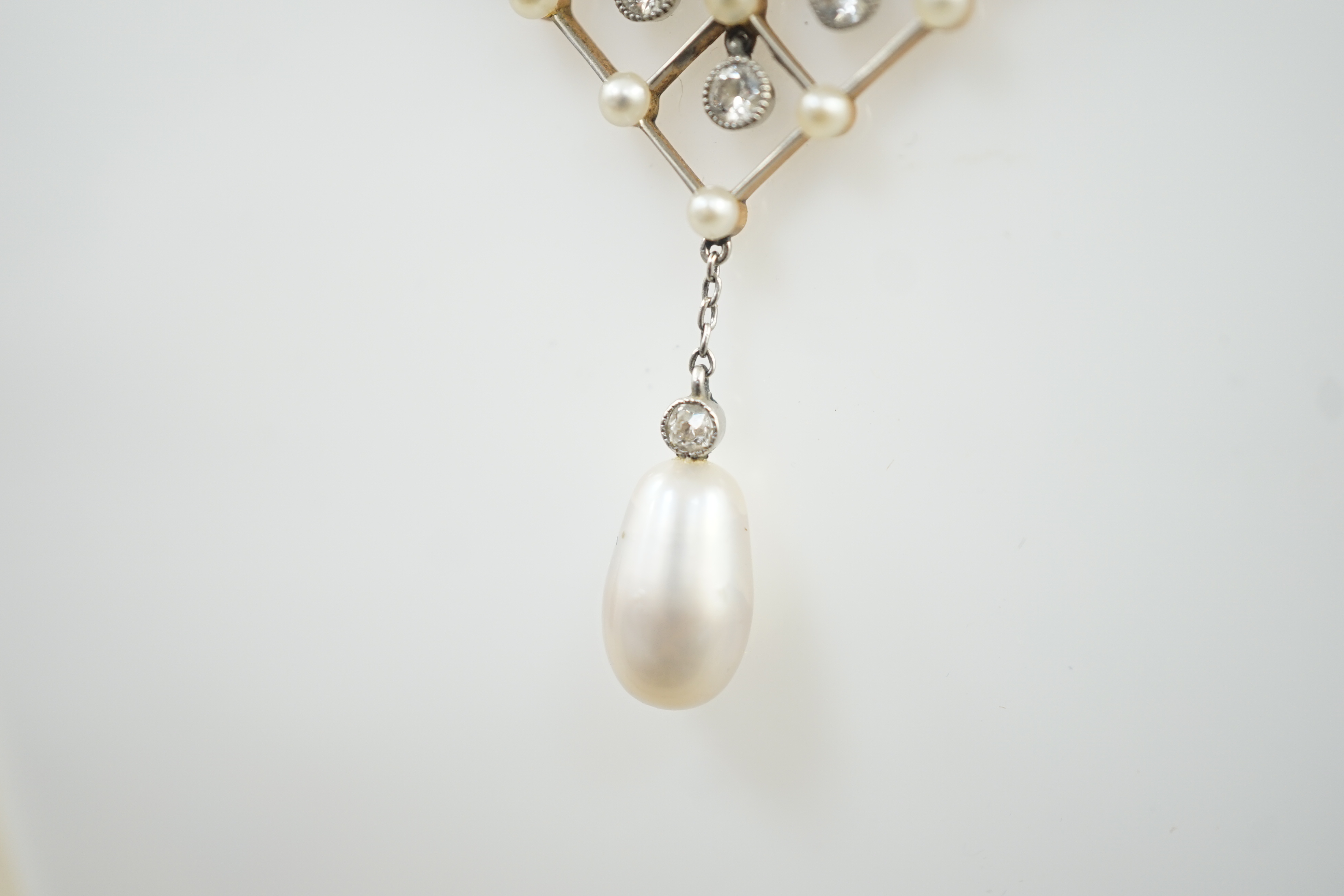 An early 20th century gold and platinum, diamond and seed pearl cluster set drop pendant necklace